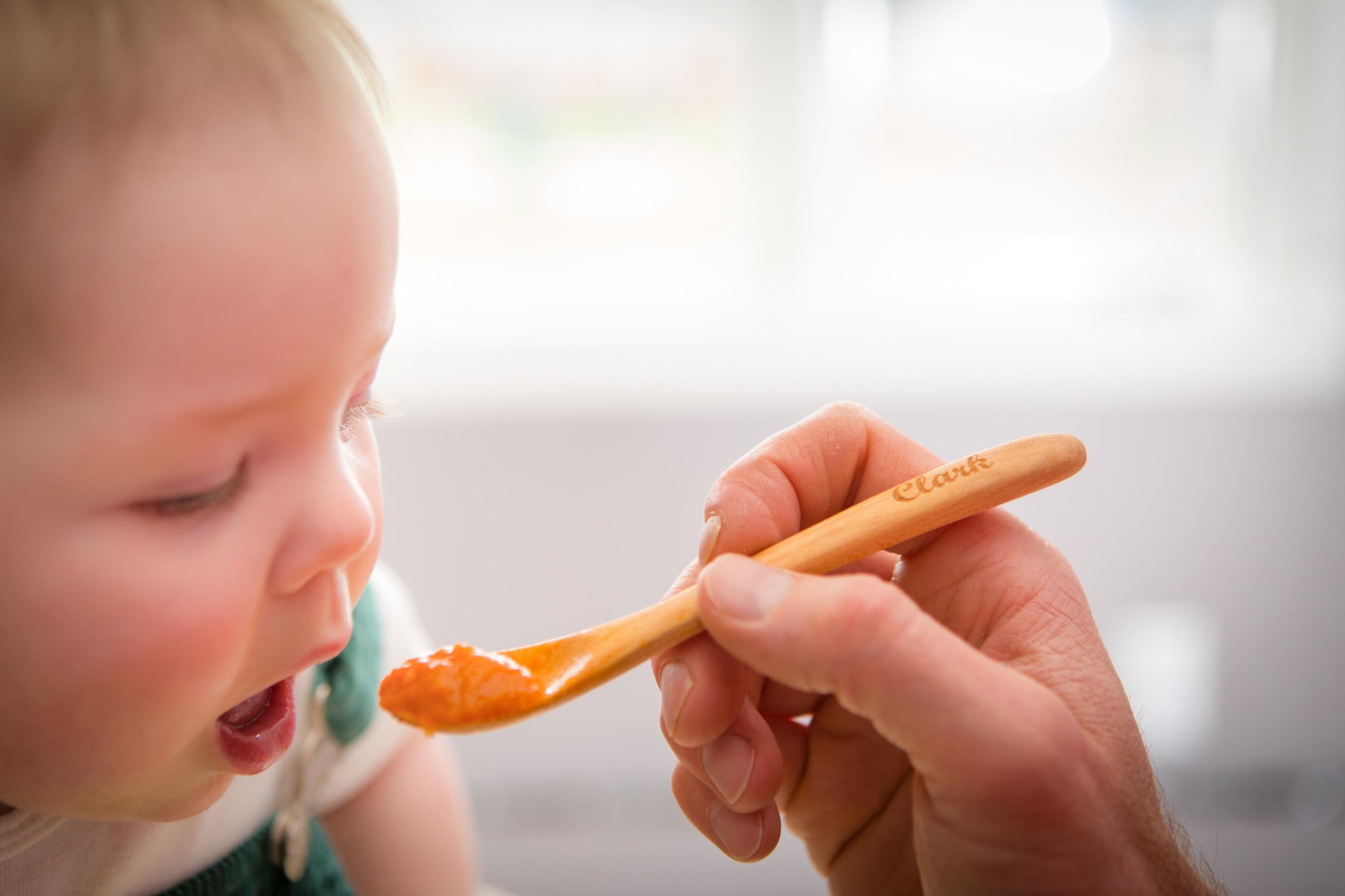 babies first wood spoon with custom engraving used for feeding