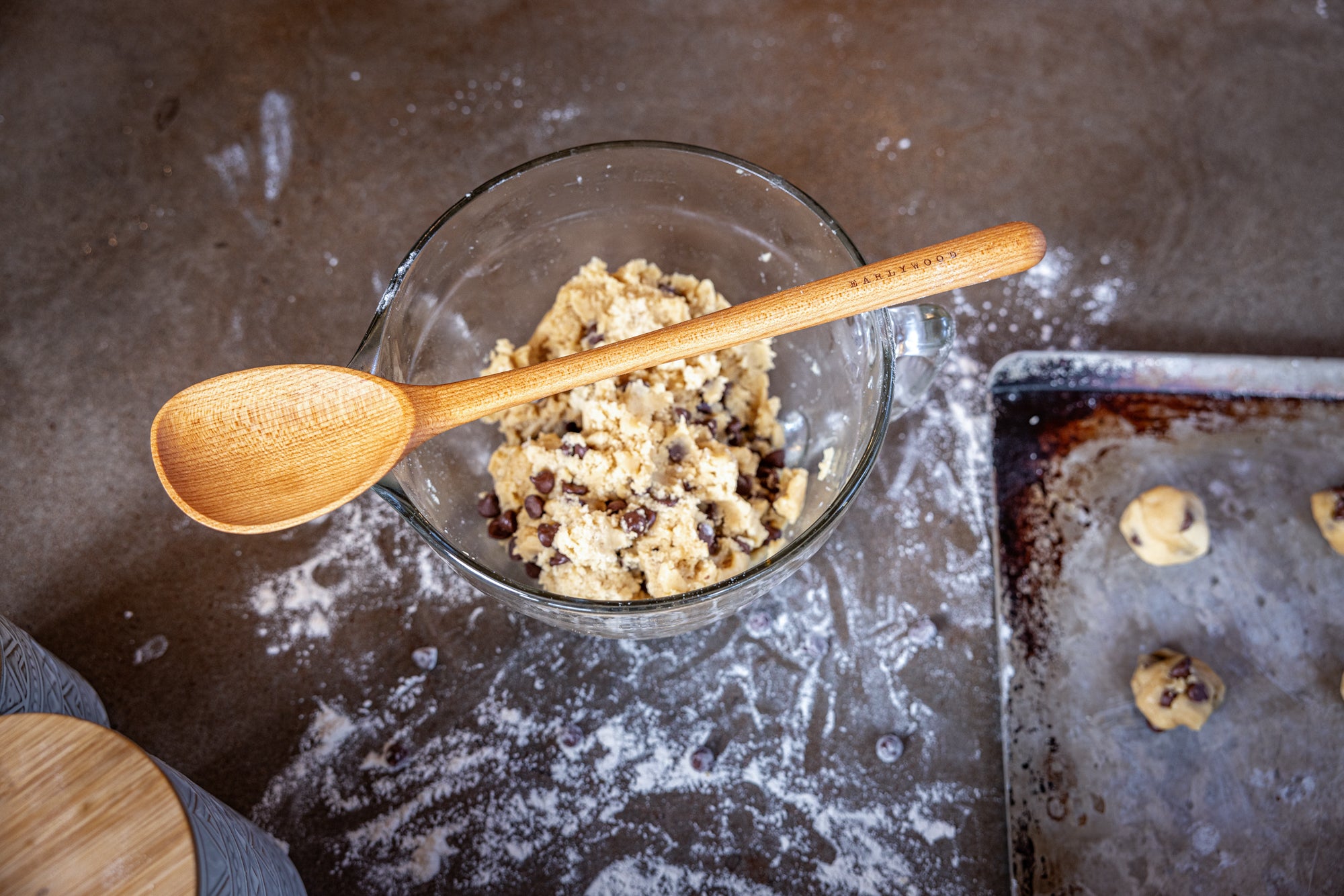 cooking spoon resting on bowl of cookie dough