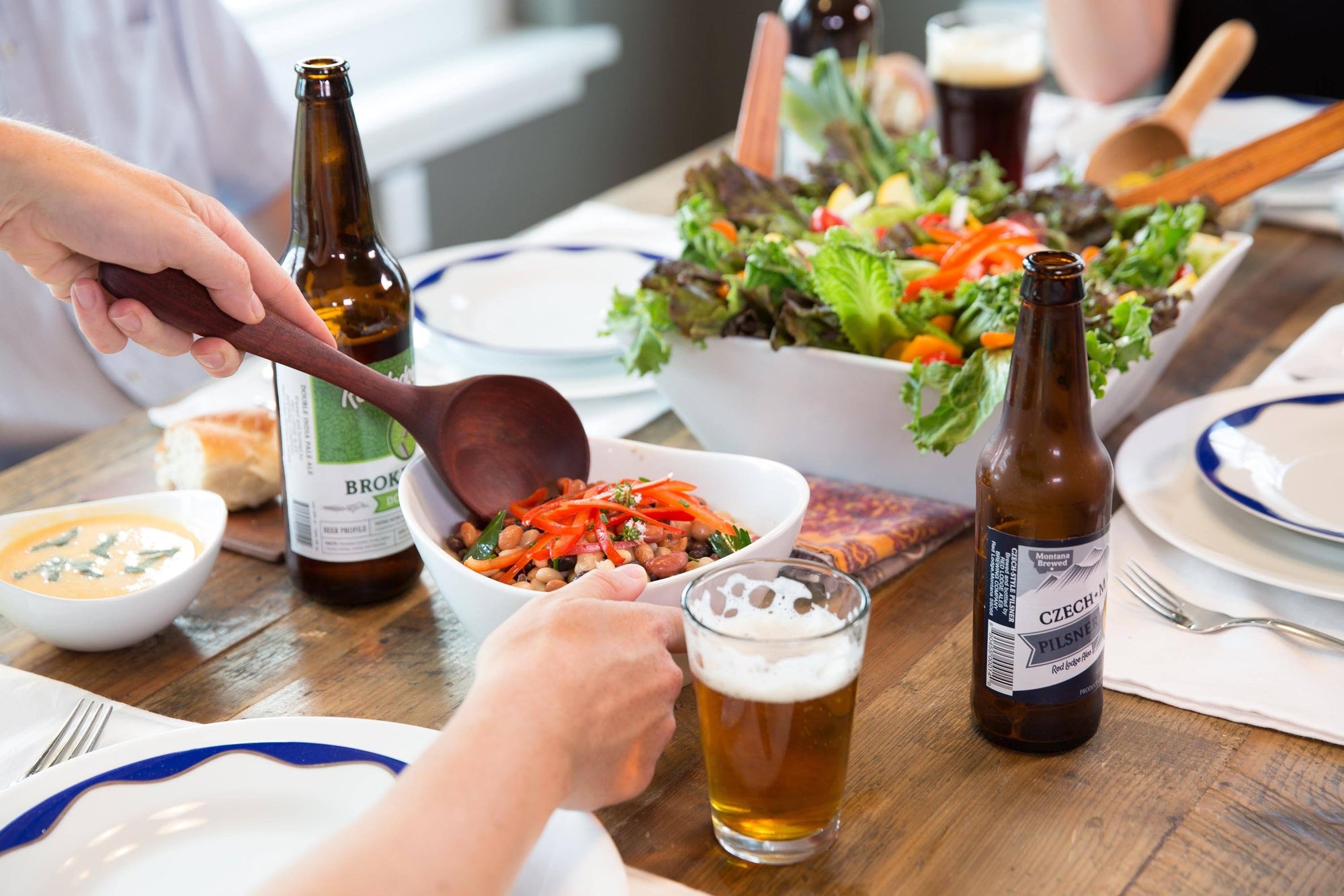 long handle wooden spoon serving bean dish with red lodge ales beers - Earlywood