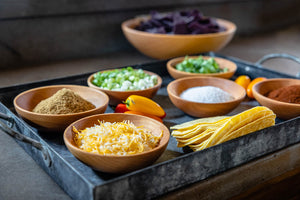 small wooden bowls as prep dishes on tray