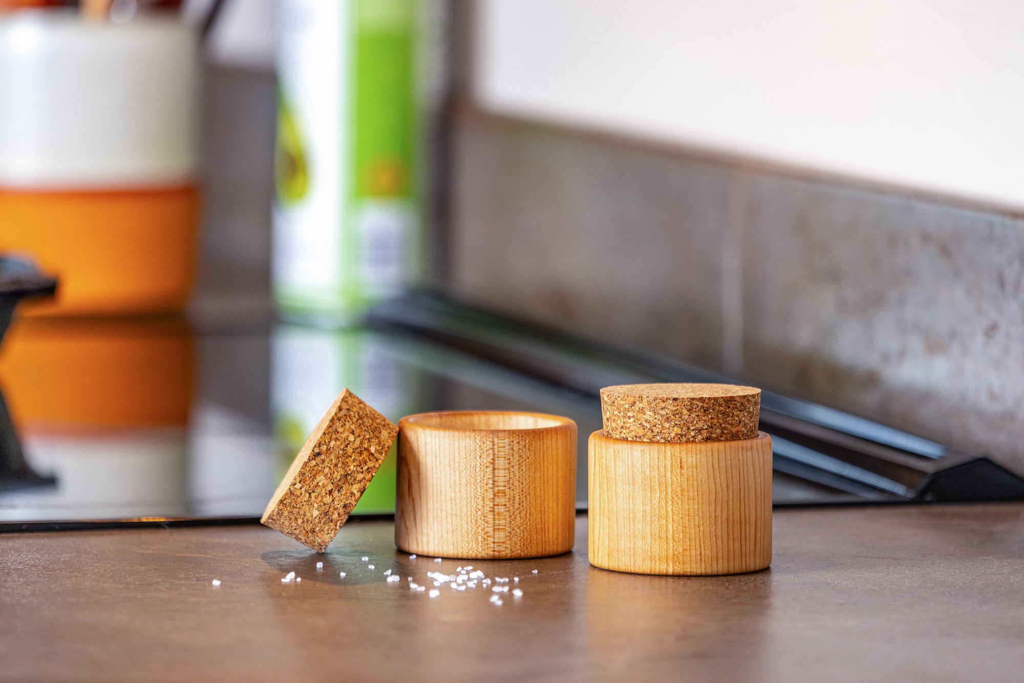 side view of two salt cups next to stove top